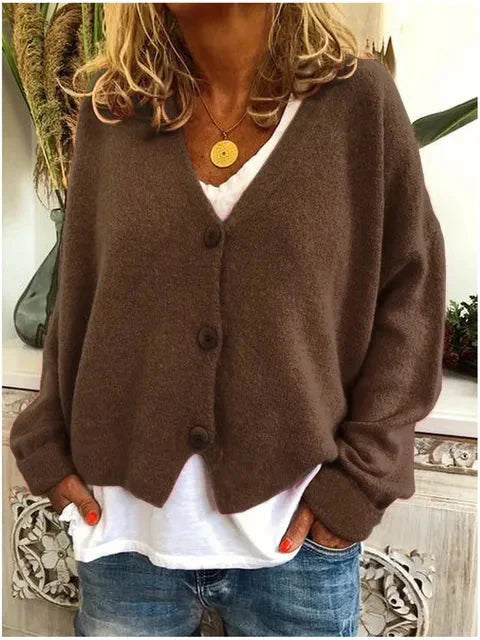 Close-up van het Dames Cardigan Vest met V-hals en Knopen met gebreide textuur en knoopsluiting