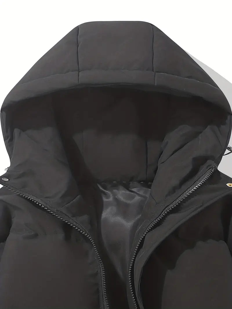 Achterkant van dames puffer coat met oversized silhouet en capuchon