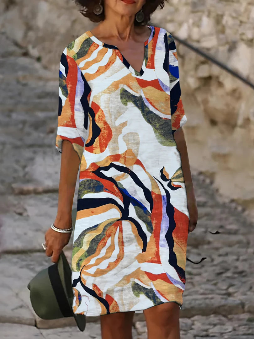 Midi jurk met driekwart mouwen en artistieke print geschikt voor strand en terras