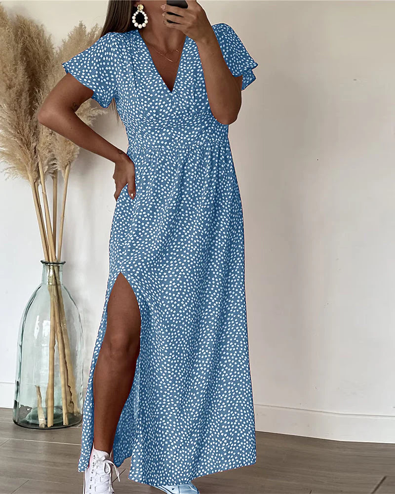 Dames zomerjurk met bloemenprint en aangetailleerde taille in rood