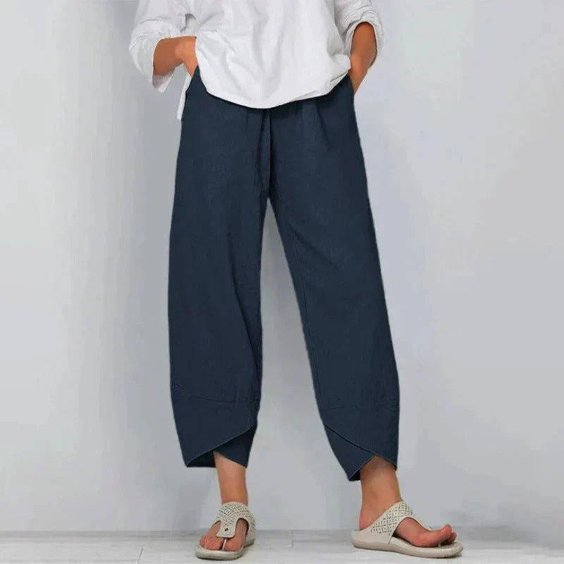 Losvallende dames linnen broek met wijde pijpen en unieke gekruiste zoom detail