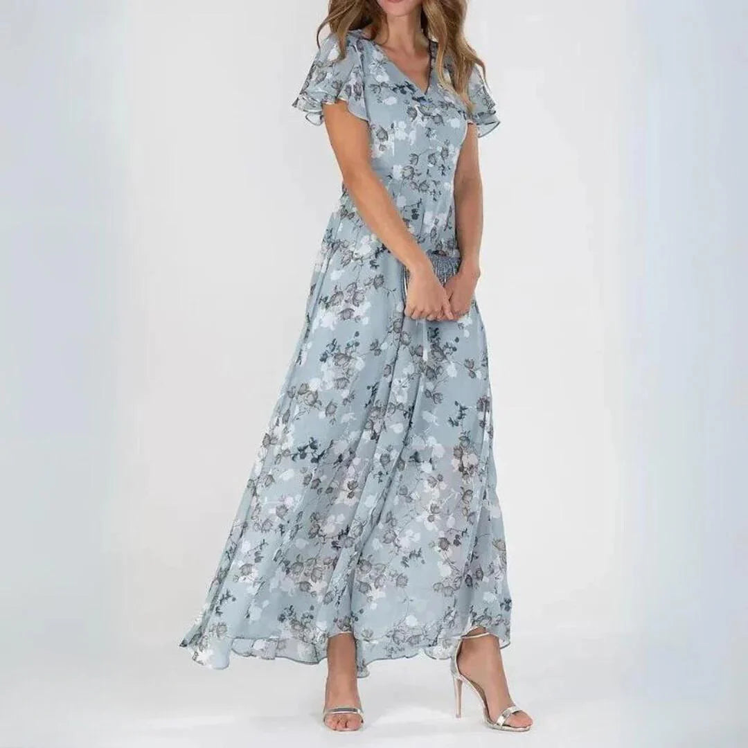 Zijkant van luchtige maxi jurk met V-hals en all-over bloemenpatroon, enkellange rok voor zomerse feesten