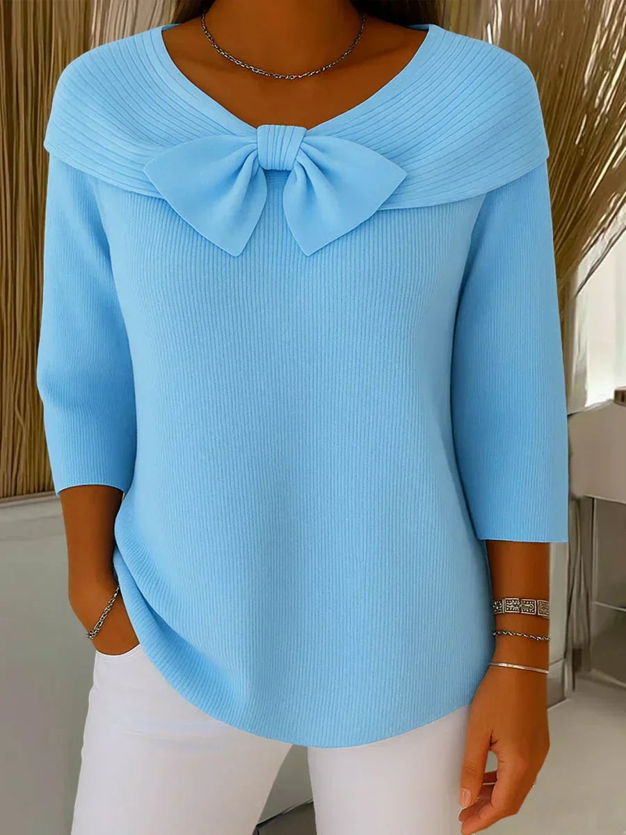 Elegante gebreide top met strik in lichtblauw met V-hals en driekwart mouwen voor dames