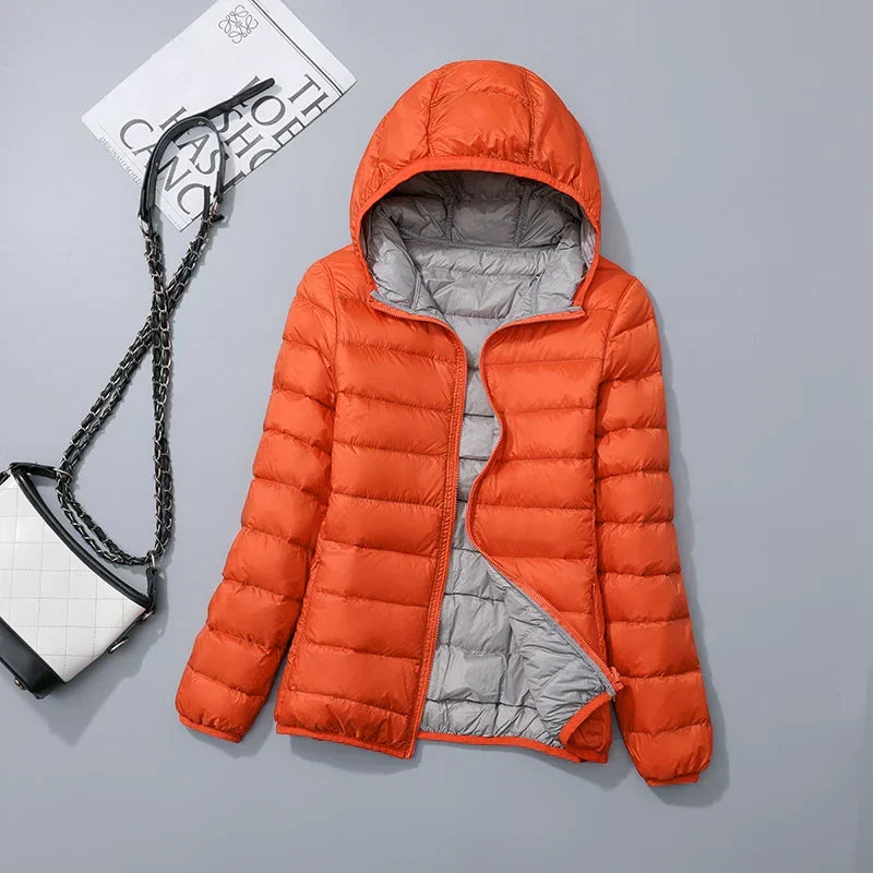 Marineblauw puffer jas met afneembare capuchon en praktische steekzakken
