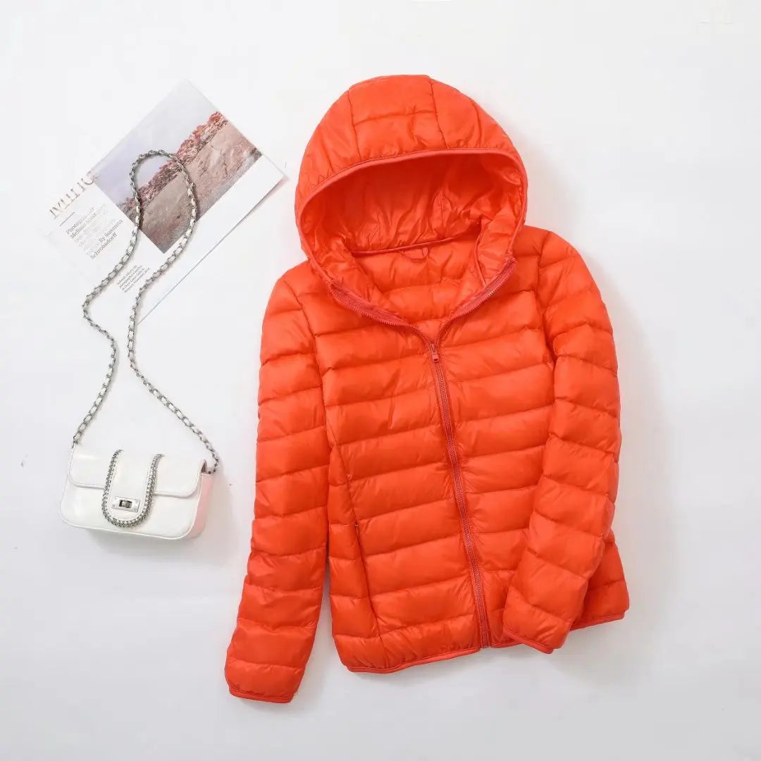 Dames puffer jas met steekzakken en volledige ritssluiting vooraanzicht detail