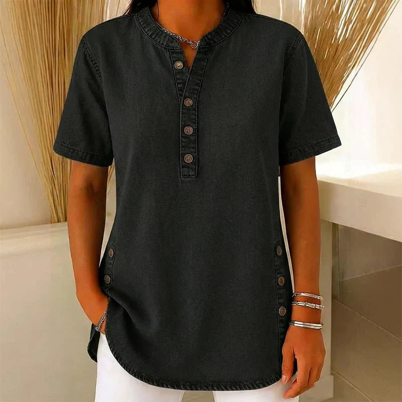 Zijaanzicht dames denim tuniek met korte mouwen en knoopdetails aan de zijkanten