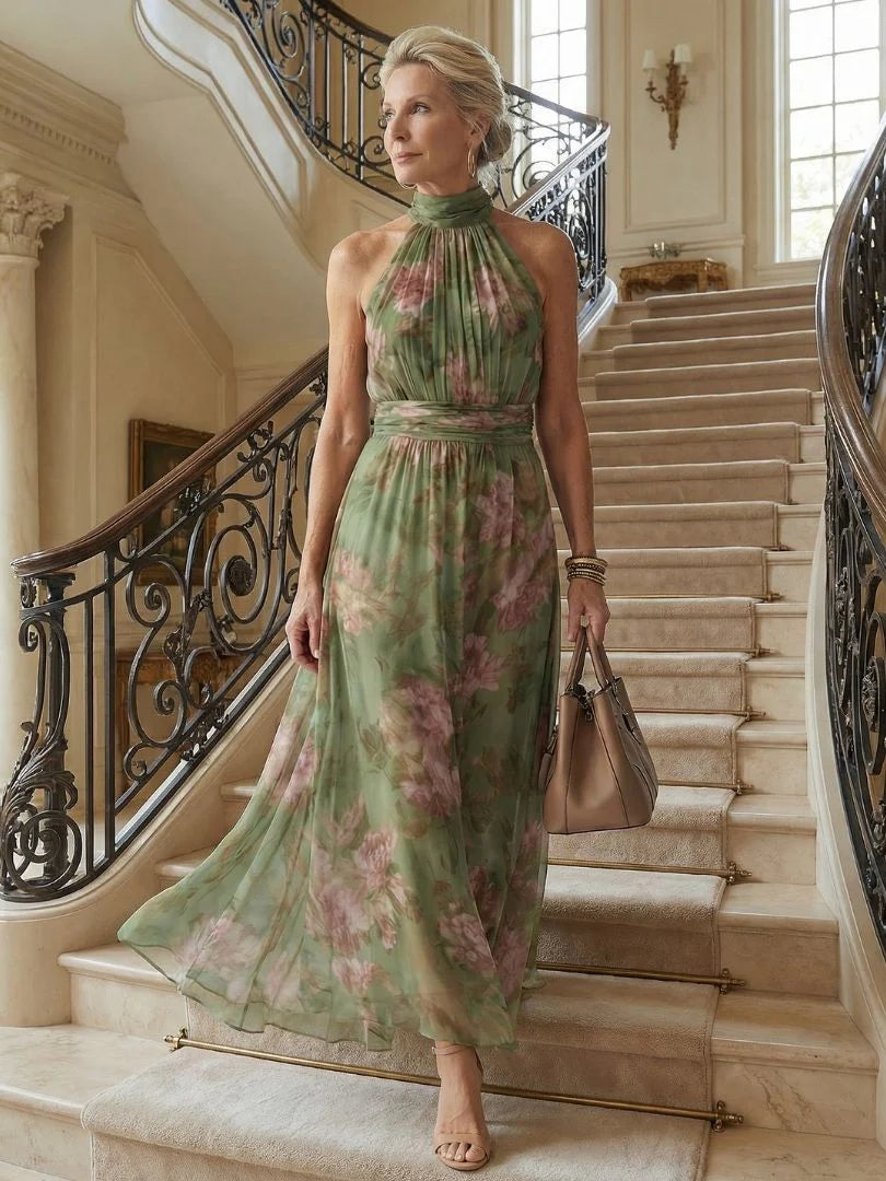 Volledige lengte halter midi jurk met bloemenprint, luchtige stof en vrouwelijk silhouet