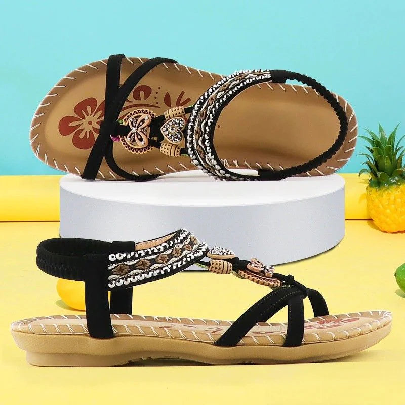 Platte sandalen met metalen en kralen decoratie voor zomers gebruik