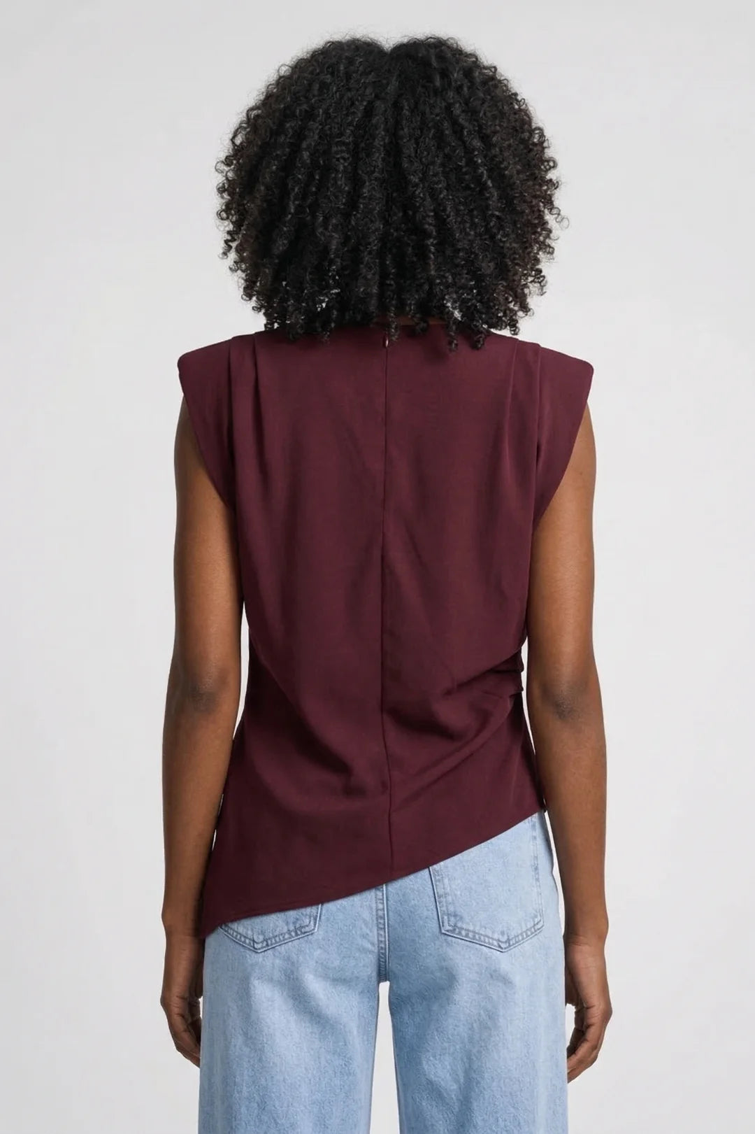 Getailleerde dames top met asymmetrische zoom en schouderpads vooraanzicht