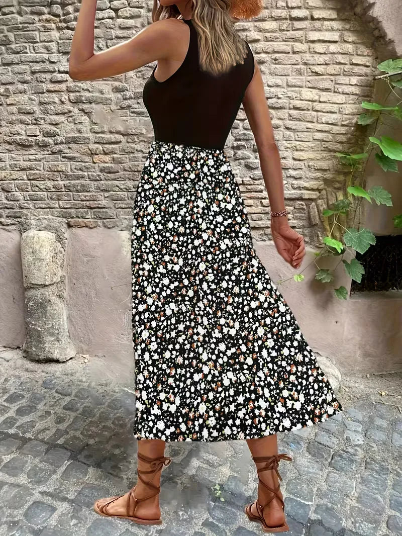 Casual maxi jurk met zwart bovenstuk en bloemenprint rok voor ontspannen zomerlook