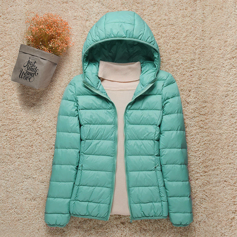 Dames gewatteerde jas met capuchon in turquoise kleur, doorgestikte panelen en ritssluiting voor herfst