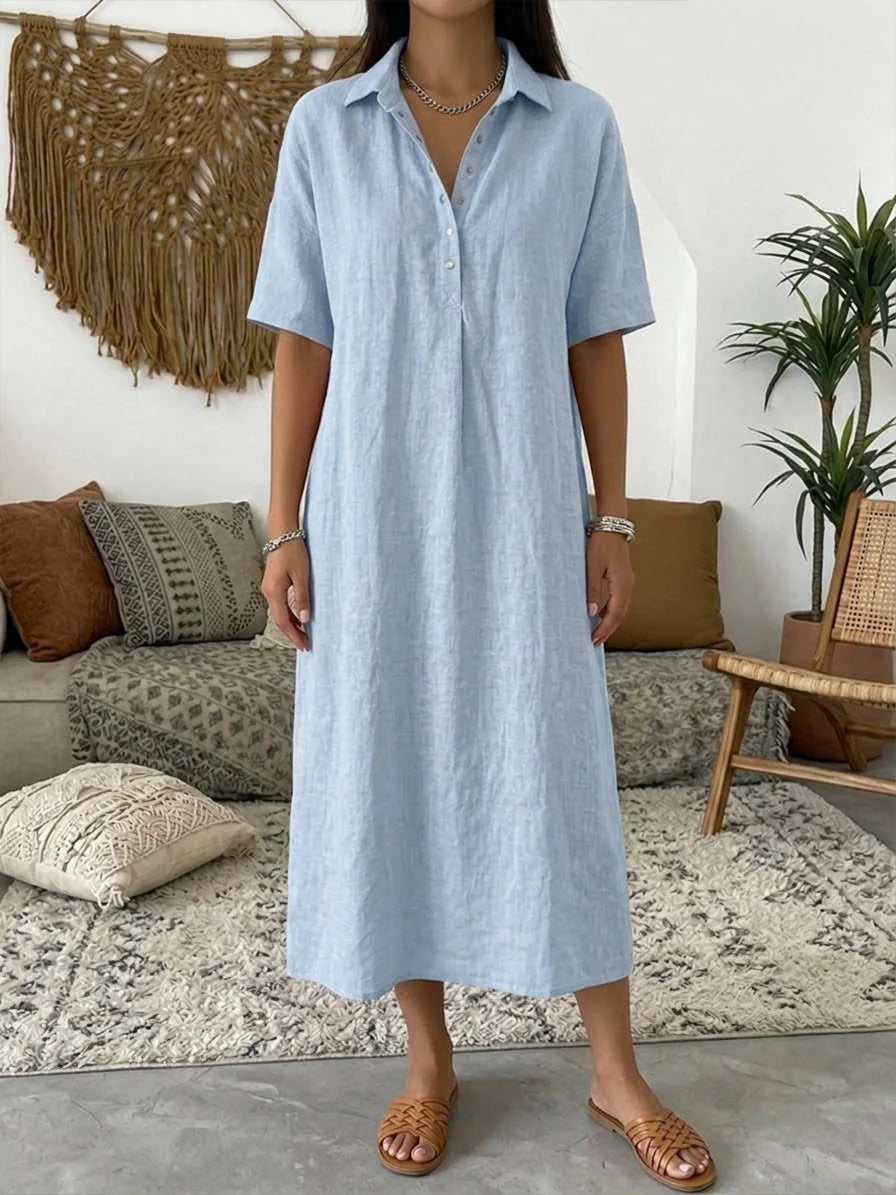 Detail van polo kraag en knoopsluiting op luchtige midi jurk voor vrouwen