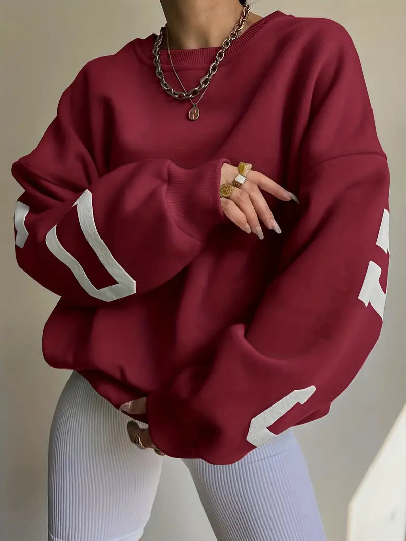 Groene oversized sweatshirt voor dames met sportieve mouwtekening en relaxed pasvorm van opzij